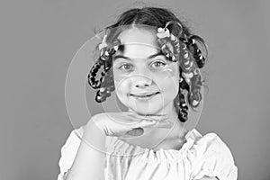 looks perfect. happy girl in hair curlers playing hairdresser salon. Easy tips making hairstyle for kids. hairdressing