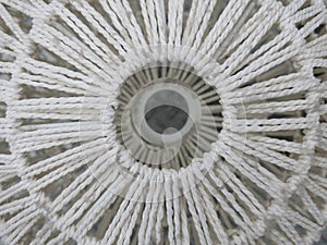 Lookthrough a knotted landshape made of white cord