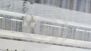 Loom weaves material from fiber to stabilize pipes