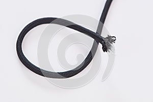 Loop of black paracord on white background
