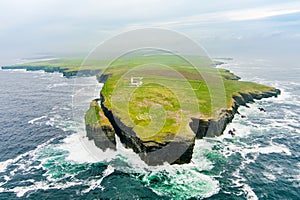 Loop Head Lighthouse, located south-east of Kilkee, on the northern Dingle Peninsula, on the cliffs of Loop Head in County Clare,