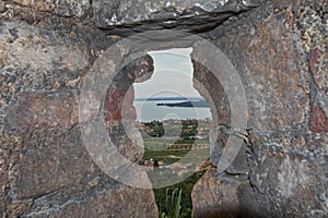 Loophole of the medieval Padenghe castle photo