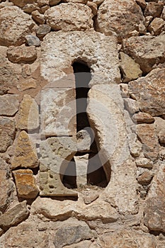 Loophole in one of the walls in the medieval castle of Arab origin of Atalaya. Villena, Alicante, Spain