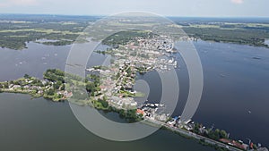 Loosdrecht Loosdrechtse Plassen aerial drone view on a summer day houses and road dyck road running through the water.