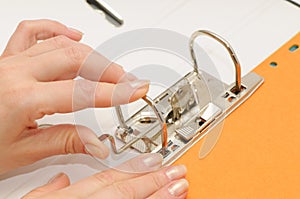 Loose-leaf binder in hand