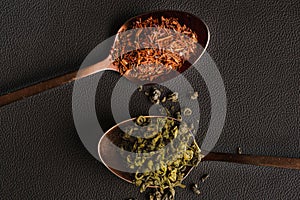 Loose leaf teas on a black background.