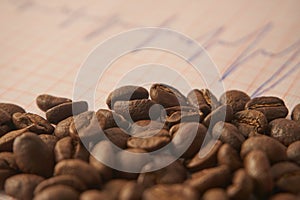 Loose roasted coffee beans on an ECG tracing