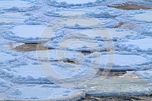 Loosely frozen ice floes on the river