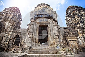 Lopburi Thailand. Monkey  Crab-eating or Long-tailed macaque  in Prang Sam Yot temple. Khmer ancient Buddhist pagoda ruins are