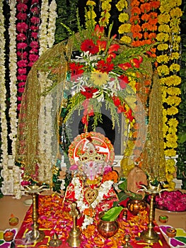 Lord Ganesh with utensils for worship