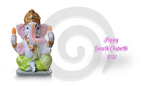 Lord Ganesha idol isolated in white background