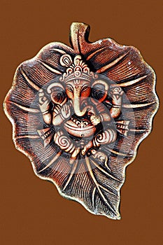 Lord Ganesha on leaf made from clay