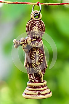 Lord krishna playing flute in green environment peacefully