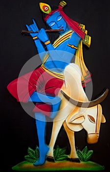 Lord Krishna sitting on the cow photo