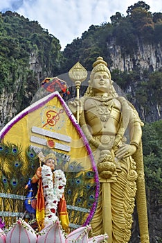 Lord Murugan statue with colorful kavadi in Thaipusam