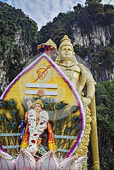 Lord Murugan statue with colorful kavadi in Thaipusam