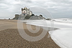 Lord of the Rock Chapel (Capela do Senhor da Pedra) on the edge of the Atlantic