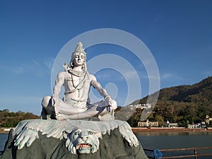 Lord Shiva staute on the banks of river ganga