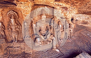 Lord Vishnu avatar Narasimha and other Hindu gods in natural cave in Badami town, India.