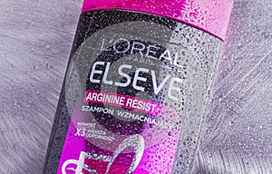 LOreal elseve shampoo isolated on gradient background.
