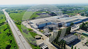 Lorries near production complex and highway bird eye view