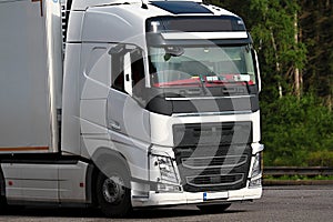 Lorries parked up outside a company`s car parking area