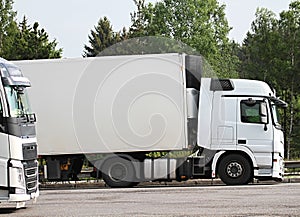 Lorries parked up outside a company`s car parking area