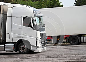 Lorries parked up outside a company`s car parking area