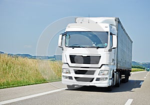 Lorry moving with trailer on lane