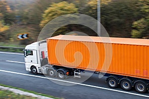 Lorry with shipping container on the road