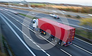 Lorry with shipping container on the road