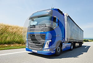 Lorry with trailer driving on highway