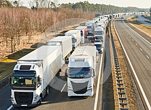 Lorry truck stack in long traffic jam on lane photo