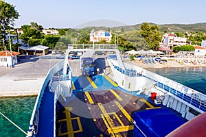 Lorry trucks are entering ferryboat, boarding cars