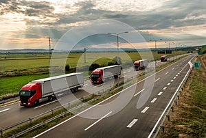 Lorry trucks in line on a country highway