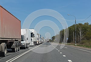 Lorry trucks row in traffic jam on highway