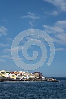 Los Abrigos with its colorful houses, the harbor and Montana Roja in the background, Tenerife, Canary Islands, Spain photo