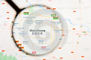 Shijiazhuang, China city visualization illustrative concept on display screen through magnifying glass photo