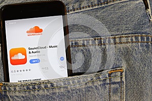 Los Angeles, California, USA - 10 October 2019:  Mobile phone with Soundcloud logo on App Store on screen close up in the blue jea