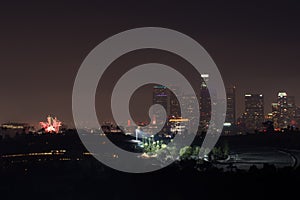 Los Angeles city lights with a display of its skyscrapers, downtown skyline against the night sky