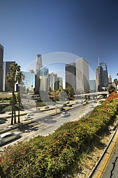 Los Angeles city skyline over the freeway traffic