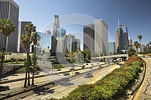 Los Angeles city skyline over the freeway traffic