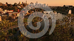 Los Angeles Downtown Sunset from Echo Park Aerial Shot Palm Trees Elevate Tilt Down in California USA