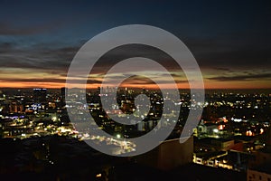 Los Angeles skyline in the distance at sunset