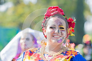 Woman with sugar skull makeup during Day of the Dead