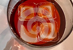 Detail of some ices cooling a glass with liquor. photo