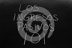 Los Ingresos Pasivos 101 On A Blackboard.  Translation: Passive Income 101