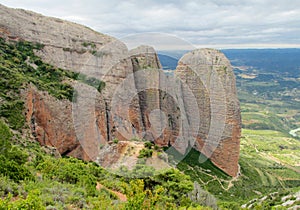 Los Mallos de Riglos unusual shaped red conglomerate rock formation in Spain photo