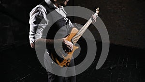 Lose up of rock guitar solo. Closeup of rock guitar player hands. Rock guitarist. Young man playing electric guitar