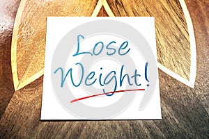 Lose Weight Reminder On Paper Lying On Wooden Table